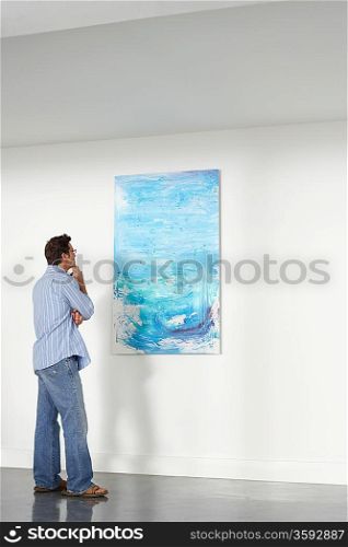 Man looking observing in art gallery