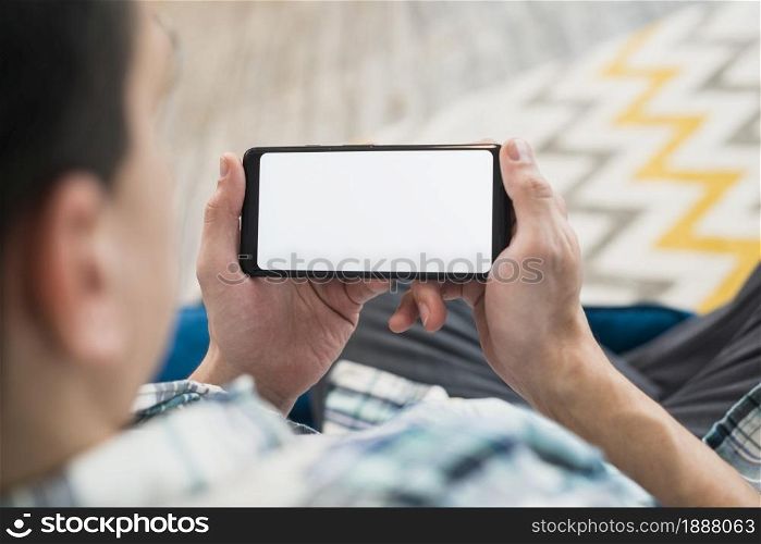 man looking smartphone settee . Resolution and high quality beautiful photo. man looking smartphone settee . High quality and resolution beautiful photo concept