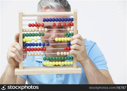 Man Looking Through Abacus