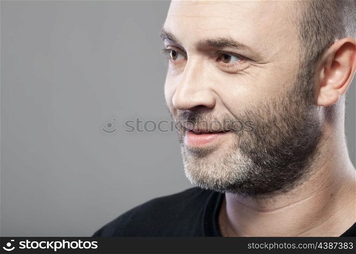 man looking to the left isolated on gray background with copyspace