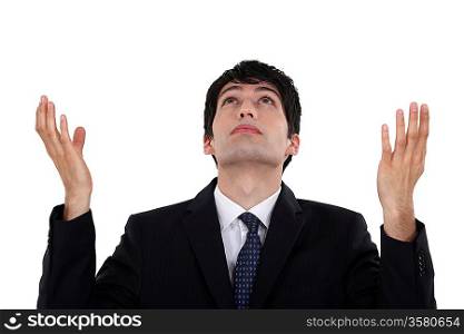 Man looking up with hands up