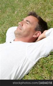 Man lying down in park