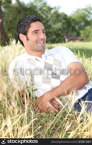 man lying in a field