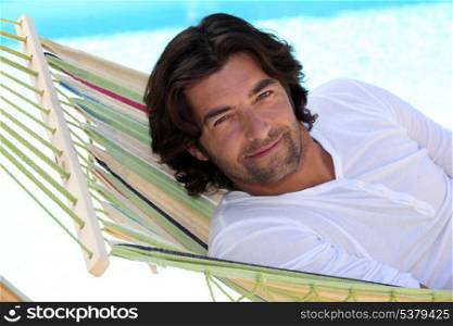 Man lying in a hammock