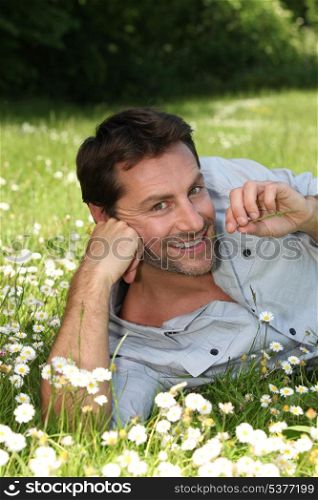Man lying in a meadow