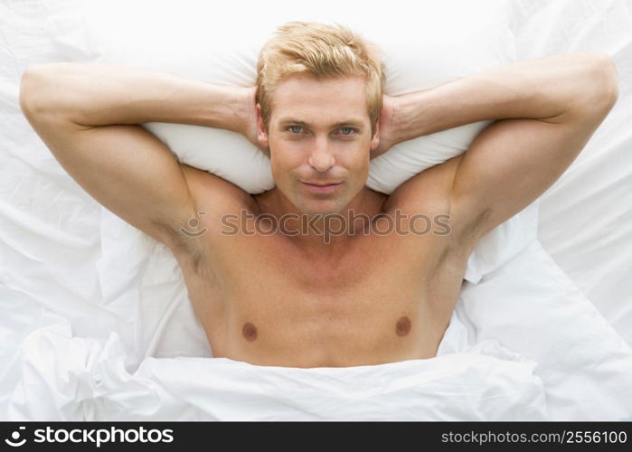 Man lying in bed relaxing
