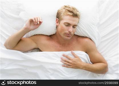 Man lying in bed sleeping