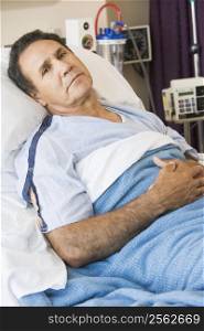 Man Lying In Hospital Bed