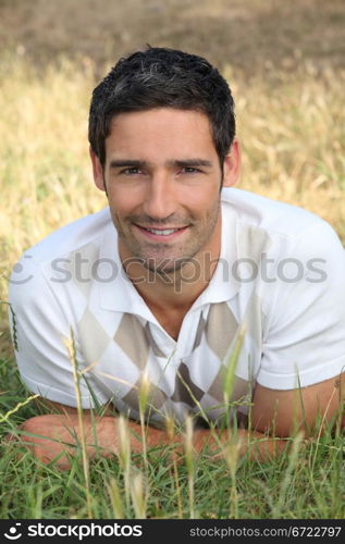 man lying on the grass