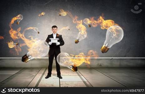 Man magician with cylinder hat. Young cheerful businessman making tricks with magic hat