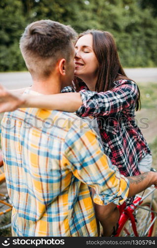 Man makes a marriage proposal on romantic picnic in summer field. Junket of man and woman, happy moments. Man makes a marriage proposal on romantic picnic