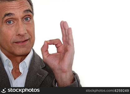 Man making a gesture of satisfaction with the fingers