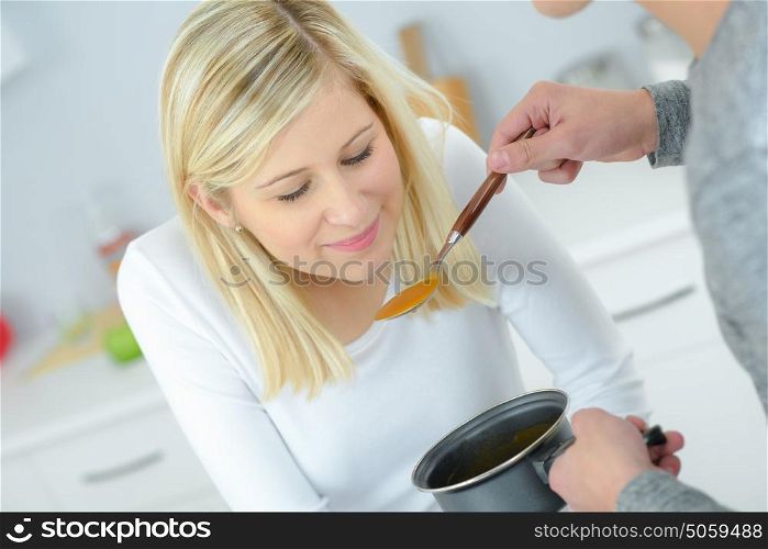man making his fiance tasting his meal