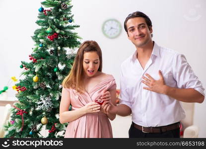 Man making marriage proposal at christmas day