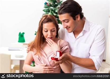 Man making marriage proposal at christmas day