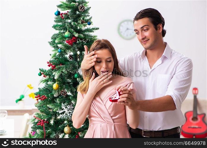 Man making marriage proposal at christmas day. The man making marriage proposal at christmas day