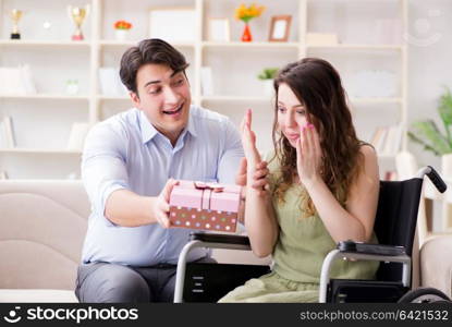 Man making marriage proposal to disabled woman on wheelchair