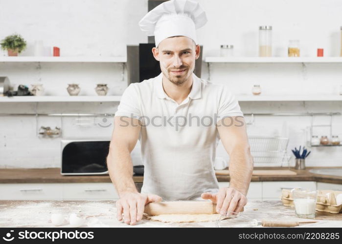 man making pizza dough