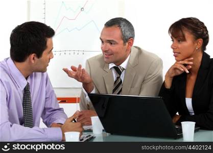Man making point in business meeting