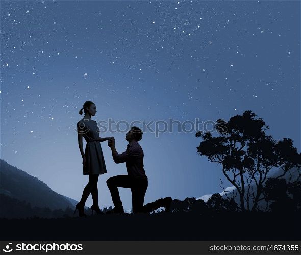 Man making proposal. Silhouettes of romantic couple under the moon light