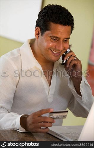 Man Making Purchase Using Cell Phone