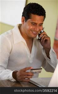 Man Making Purchase Using Cell Phone