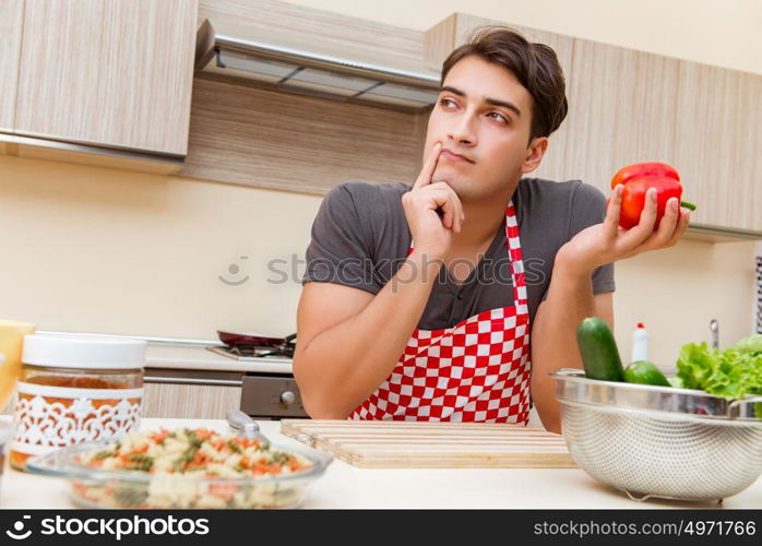 Man male cook preparing food in kitchen