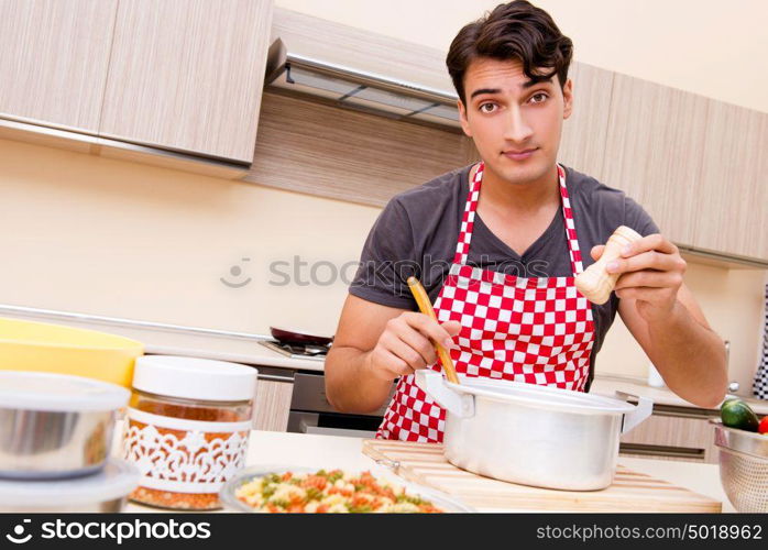 Man male cook preparing food in kitchen