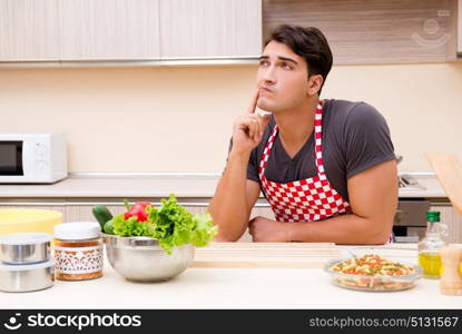 Man male cook preparing food in kitchen