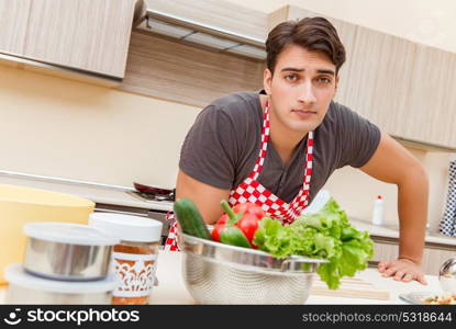 Man male cook preparing food in kitchen