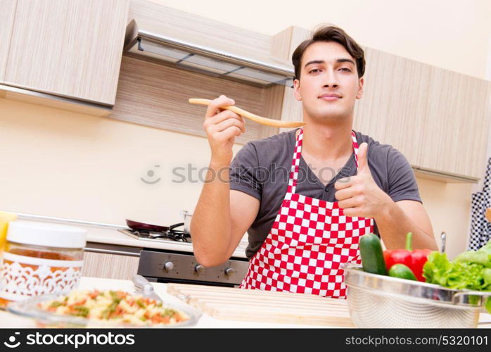 Man male cook preparing food in kitchen