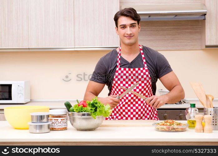 Man male cook preparing food in kitchen