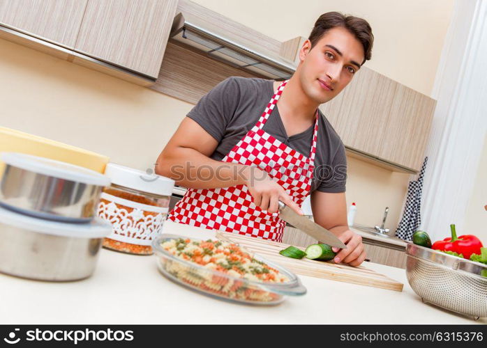 Man male cook preparing food in kitchen