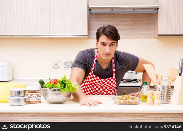 Man male cook preparing food in kitchen