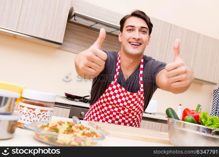 Man male cook preparing food in kitchen