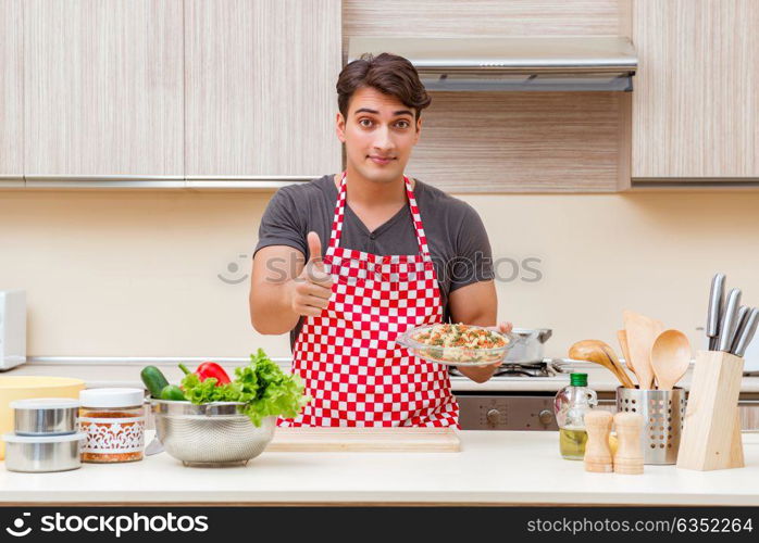 Man male cook preparing food in kitchen