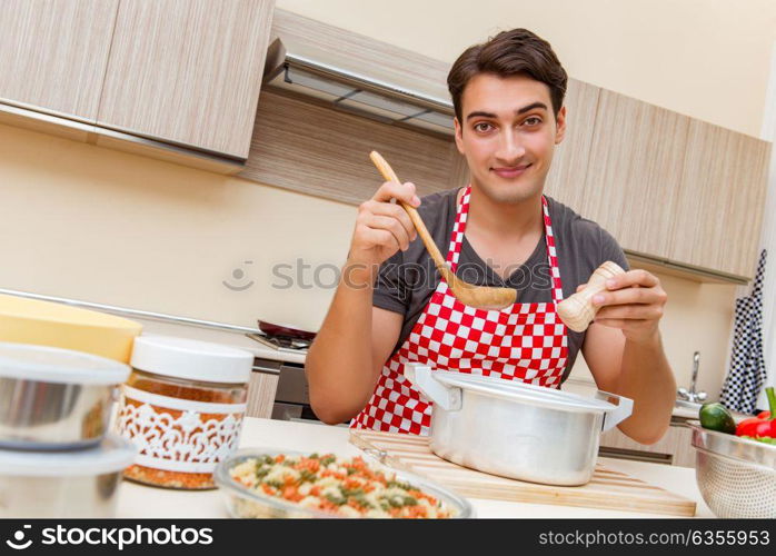 Man male cook preparing food in kitchen