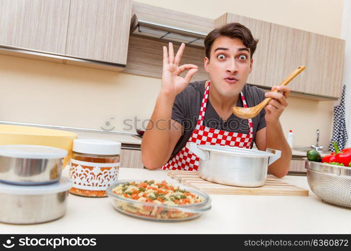 Man male cook preparing food in kitchen