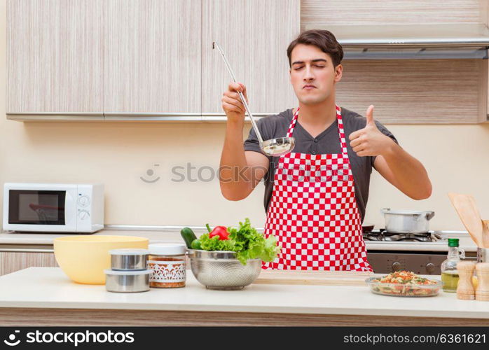 Man male cook preparing food in kitchen