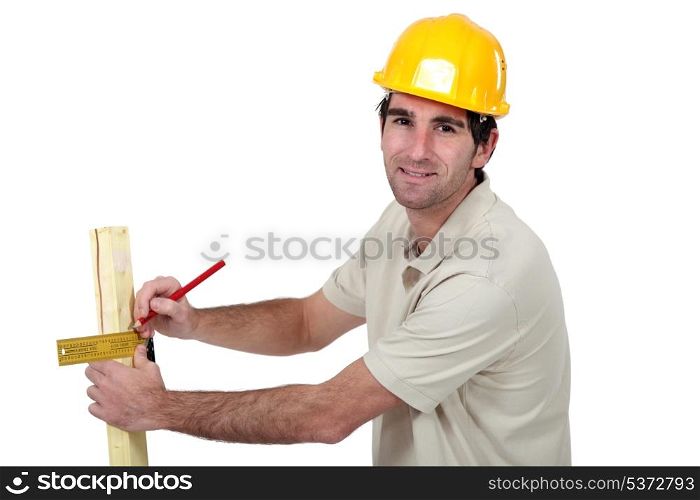 Man marking timber