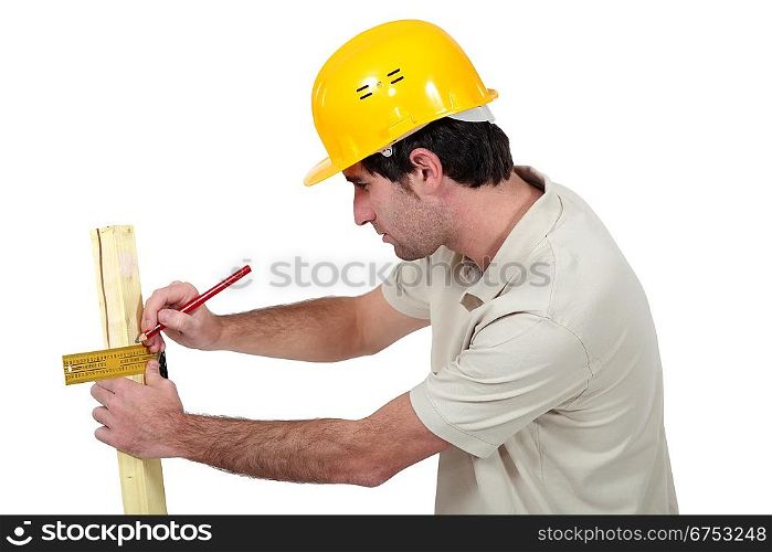 Man marking wood with setsquare