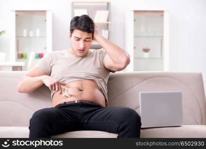 Man measuring body fat with calipers