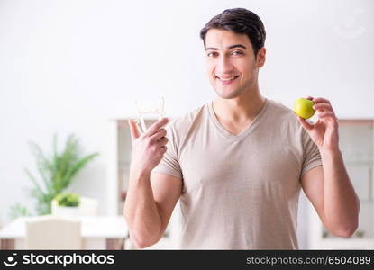 Man measuring body fat with calipers