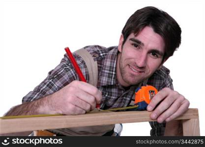 Man measuring furniture