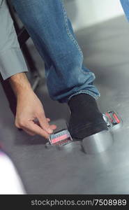 man measuring his feet