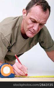 Man measuring wood