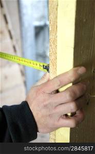 Man measuring wood