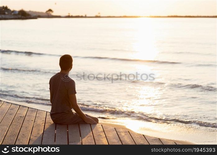 man meditating beach. High resolution photo. man meditating beach. High quality photo