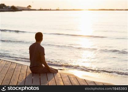 man meditating beach. High resolution photo. man meditating beach. High quality photo