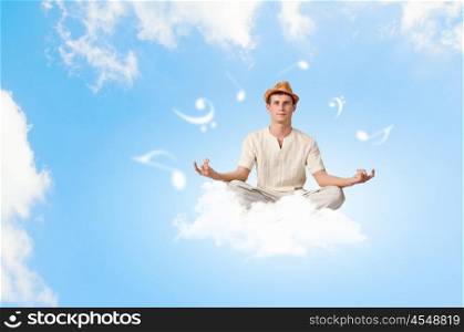 Man meditating. Image of young man sitting on clouds in lotus pose